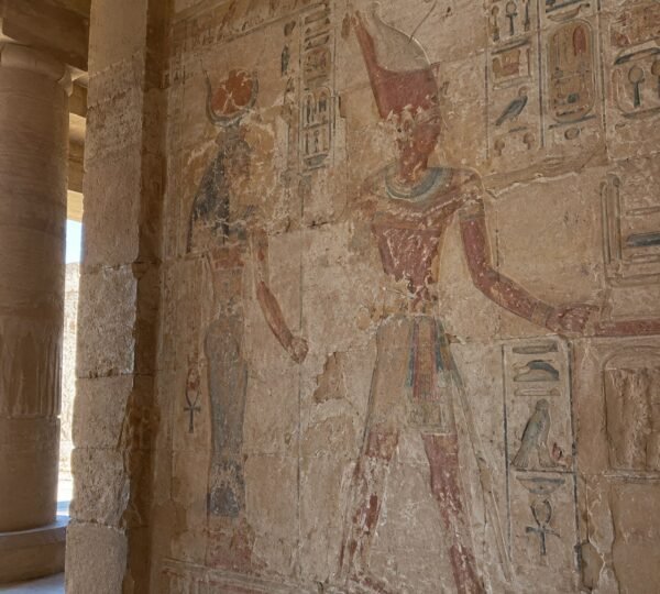 Colored relief with ancient Egyptian figures inside the Temple of Derr