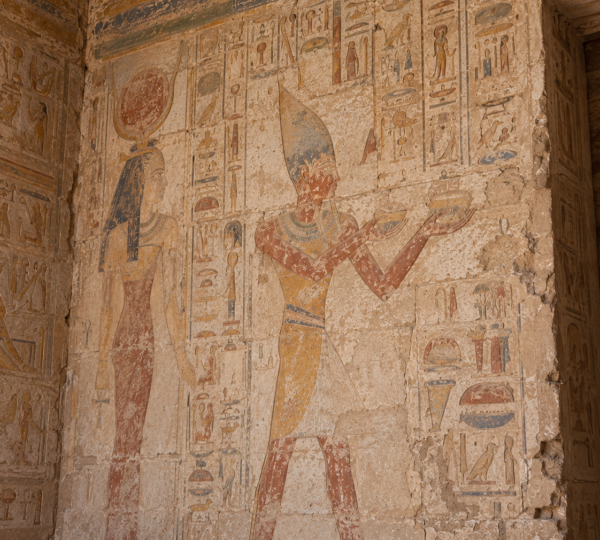 Colorful painted relief of a pharaoh inside the Temple of Amada