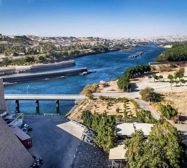 Aerial view of the Nile River and Aswan High Dam with boats on the water
