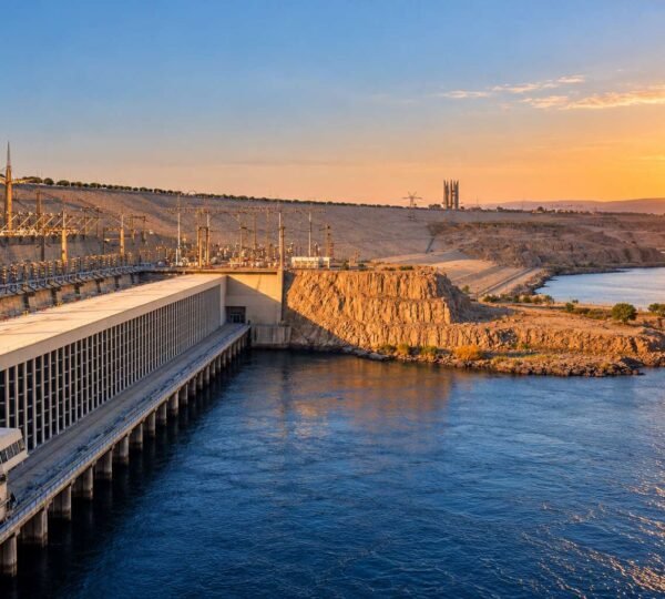 Sunset sky glowing orange over the Aswan High Dam in Egypt