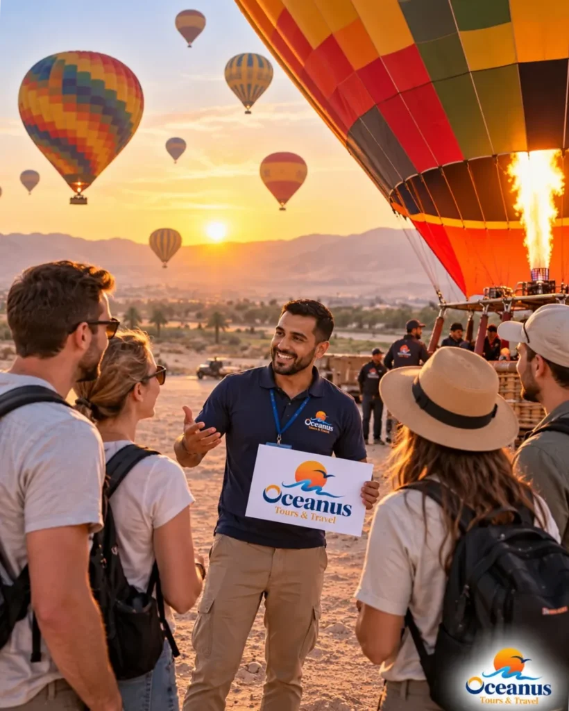 Oceanus tour guide welcoming tourists at a hot air balloon launch site in Luxor at sunrise