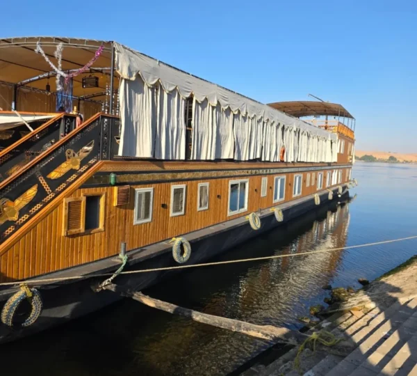 Traditional wooden dahabiya with a shaded upper deck on the Nile